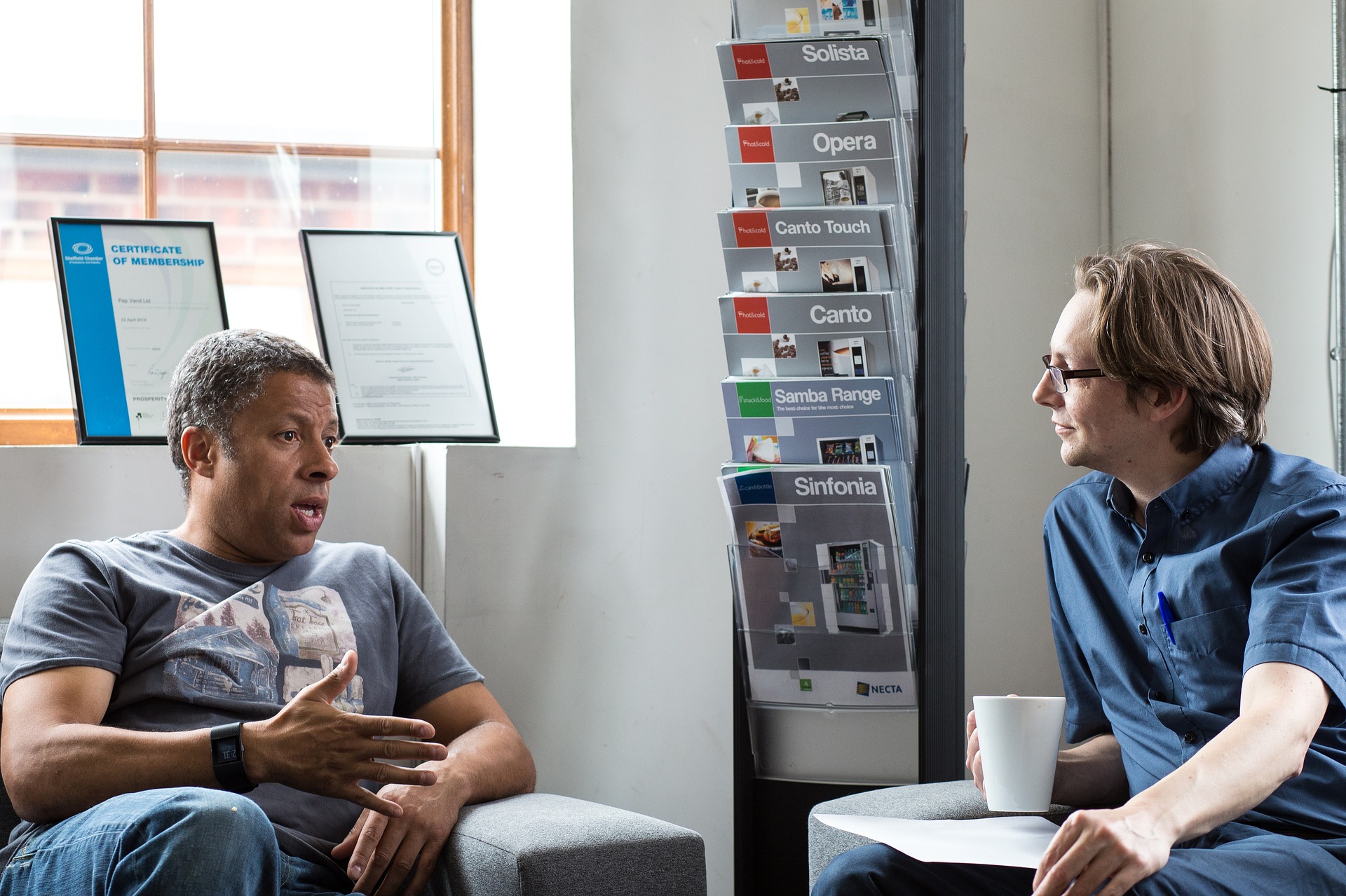 Friends Advice Men Talking Informal Meeting Waiting Room Magazines Nel Tax and Financial Solutions