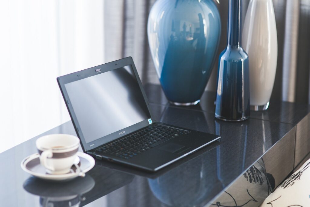 ntfs global financial transition consulting breakdown blue and tan vases laptop tea cup coffee desk window serene calm office home
