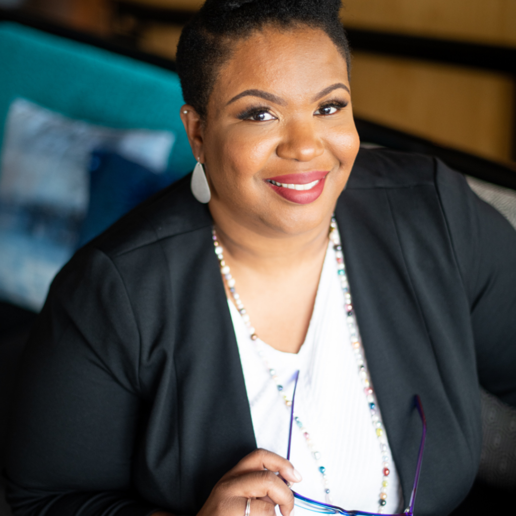 Shan-Nel D Simmons founder ceo financial educator tax specialist consultant author workshop leadership pearls blazer black african american woman smile lipstick glasses blue financial transition consultant advisor family leaders business organizations nonprofit board governance