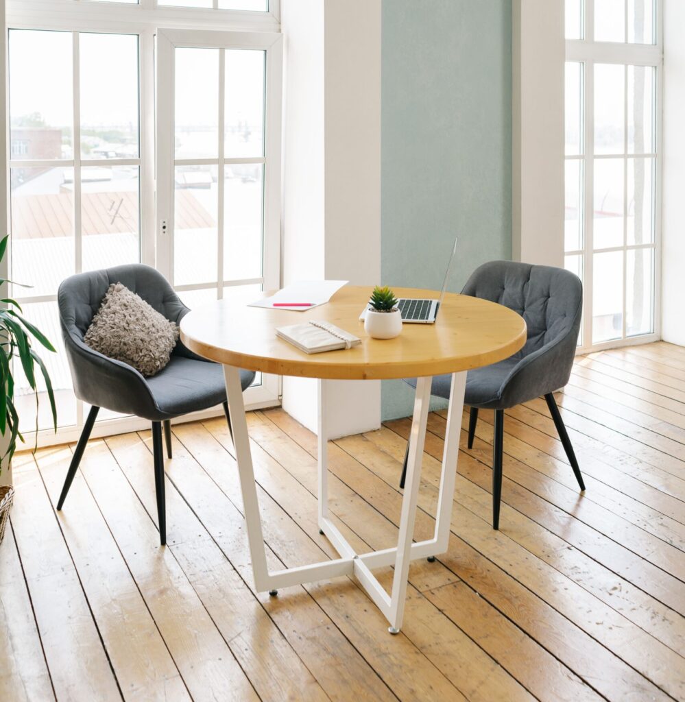 chairs table sunglasses window plant pillow blue calm serene